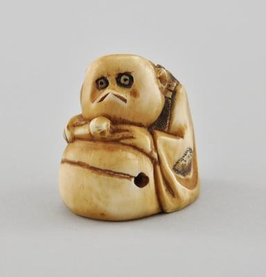 Appraisal: Shojo with Drum Ivory Netsuke The carved figure of Shojo