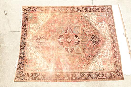 Appraisal: ORIENTAL RUG Late th century Room size Heriz Ivory spandrels