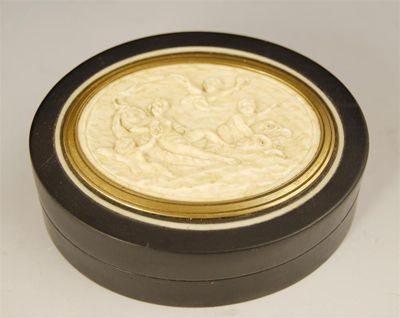 Appraisal: A late th century oval ebony snuff box with an