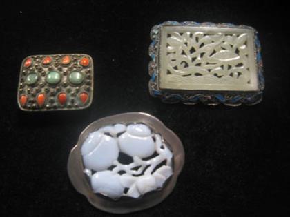 Appraisal: Group of jade brooches Three brooches of varying jade color