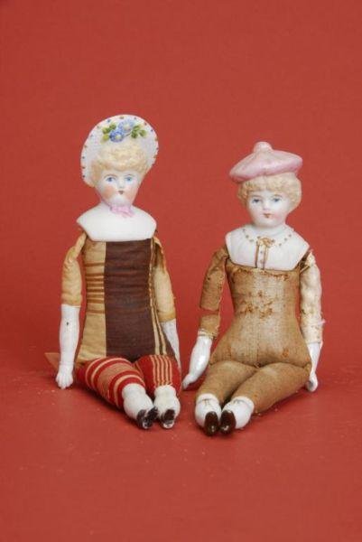 Appraisal: Two Hertwig Dolls with Molded Bonnets Germany ca Hertwig bisque