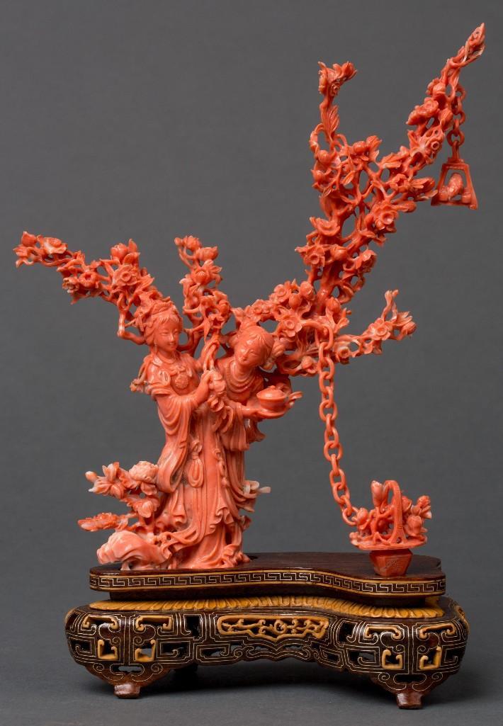 Appraisal: A CHINESE CARVED CORAL FIGURAL GROUP Fine carved coral figural