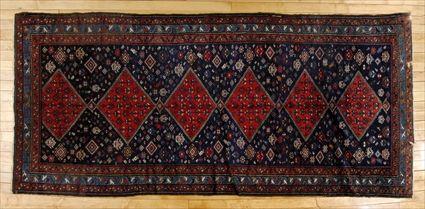 Appraisal: NORTHWEST PERSIAN RUNNER Worked with stepped rose medallions on a