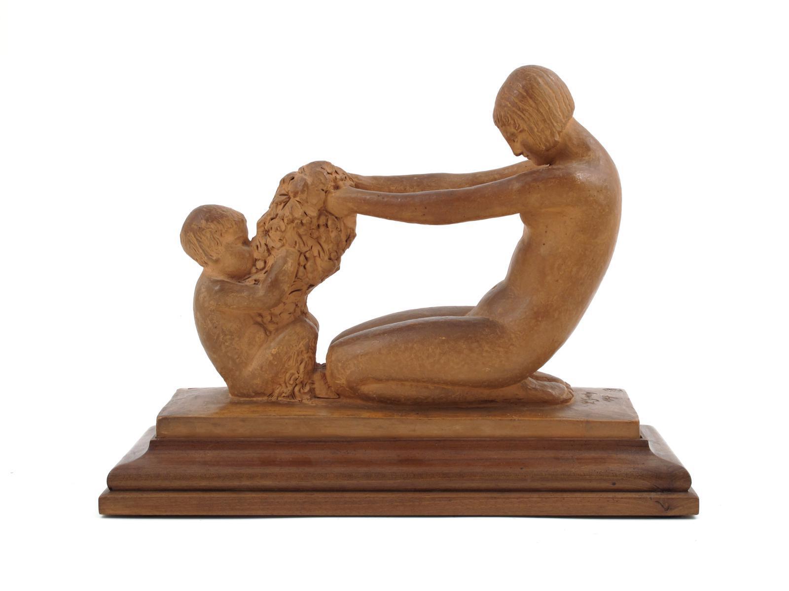 Appraisal: A terracotta model of a naked female and a fawn