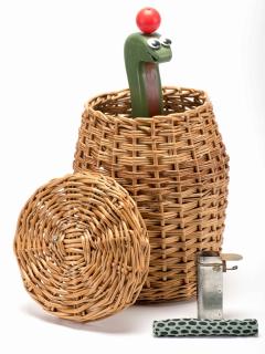 Appraisal: Snake Basket England Jack Hughes ca A woven basket contains