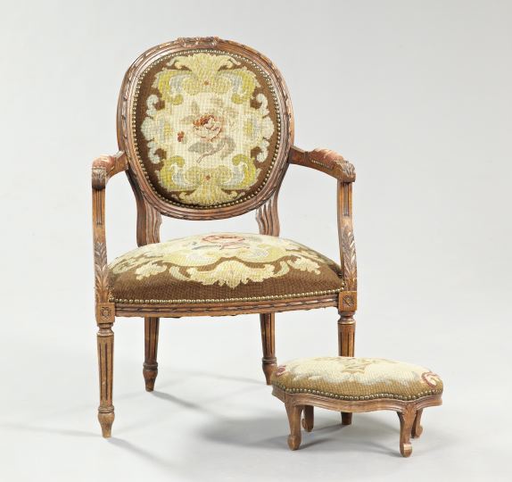 Appraisal: Louis XVI-Style Fruitwood Fauteuil and Footstool fourth quarter th century