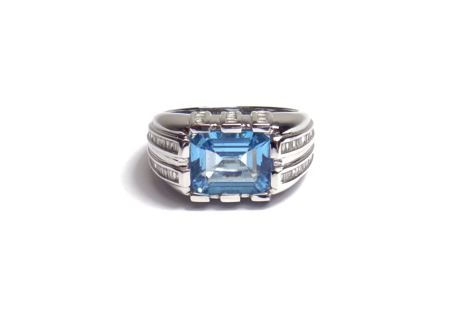 Appraisal: A white gold diamond and blue topaz set ring mounted