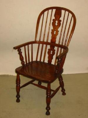 Appraisal: AN ASH AND ELM WINDSOR ARMCHAIR of high hoop back