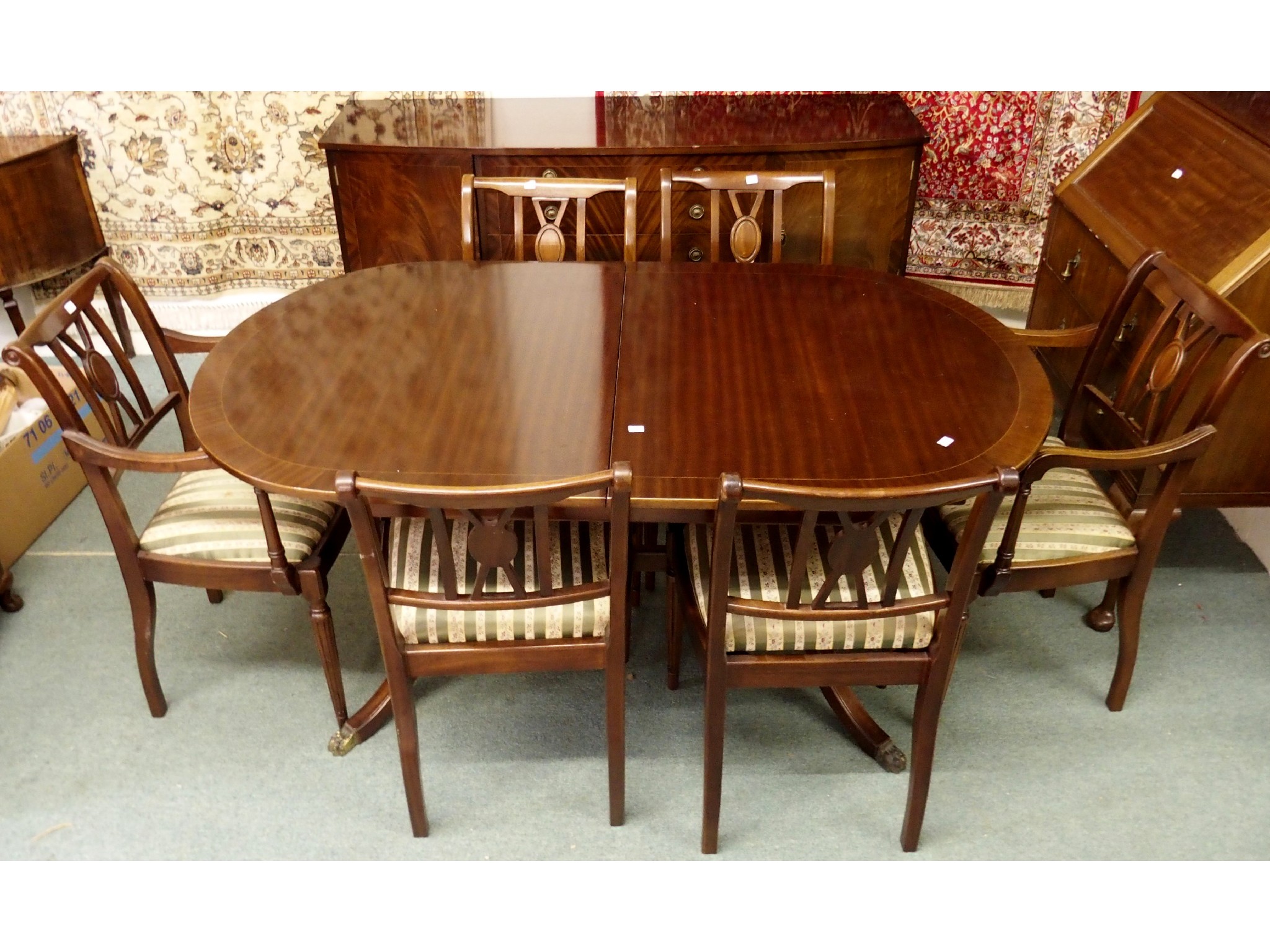 Appraisal: A mahogany inlaid sideboard D-end dining table four dining chairs