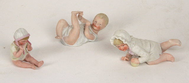 Appraisal: Three German bisque Piano Baby models a girl with a