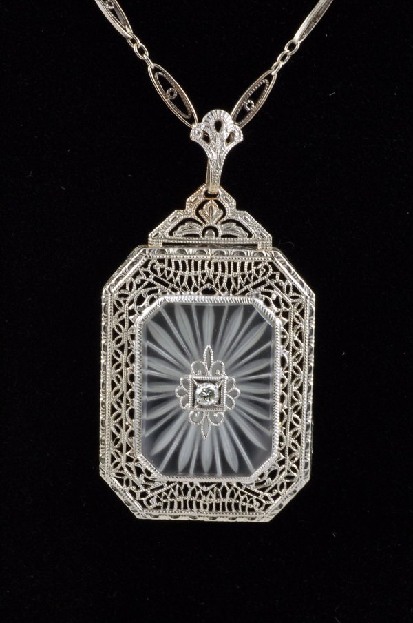 Appraisal: White gold filigree and diamond necklace Filigree pendant mm x