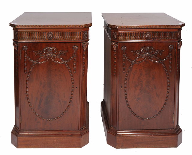 Appraisal: A PAIR OF MAHOGANY PEDESTALS or plinths in the manor