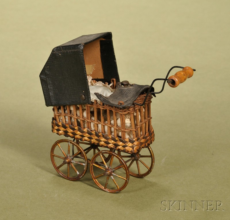 Appraisal: Miniature Doll's Carriage Germany c a wicker rattan carriage body