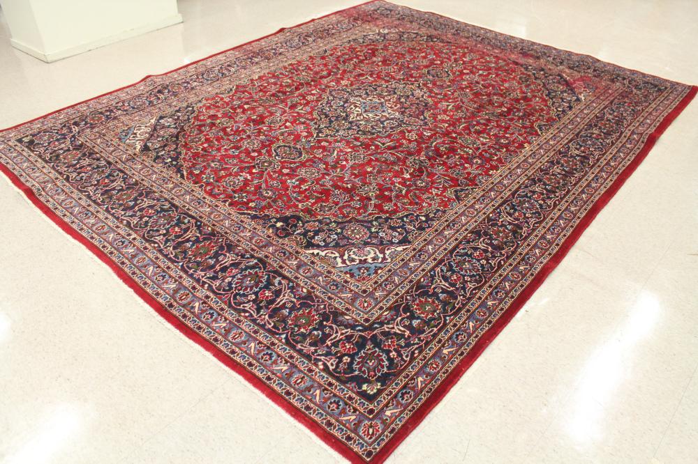 Appraisal: HAND KNOTTED PERSIAN CARPET floral and central floral medallion design