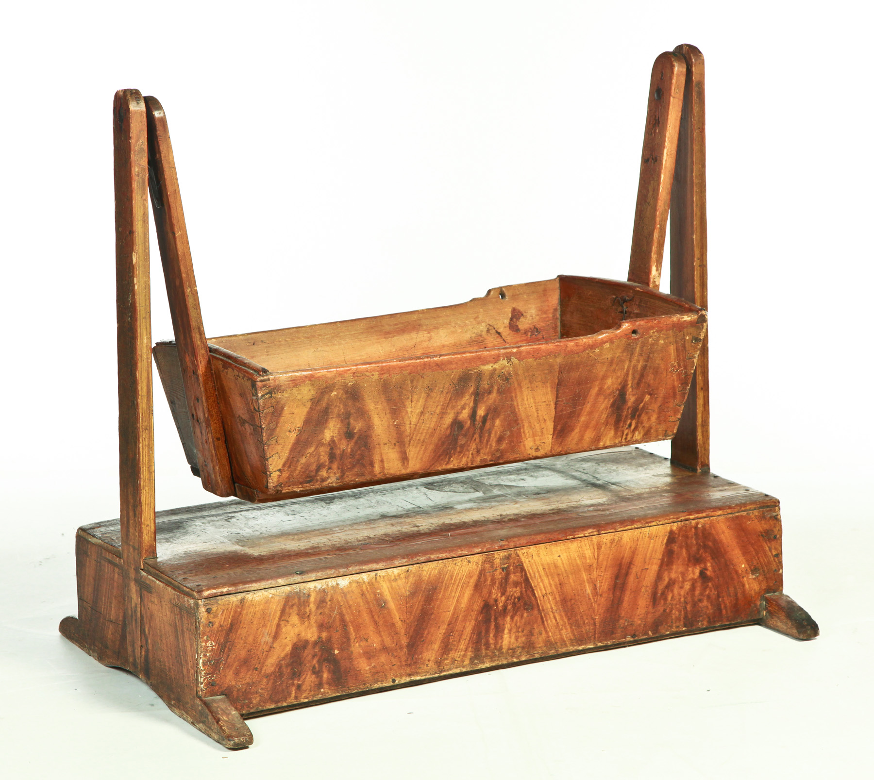 Appraisal: DECORATED EUROPEAN CRADLE Nineteenth century pine Dovetailed cradle suspended from