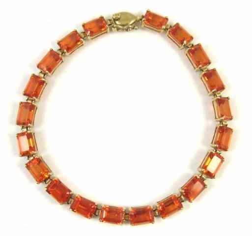 Appraisal: ORANGE SAPPHIRE AND TEN KARAT GOLD BRACELET - inches in