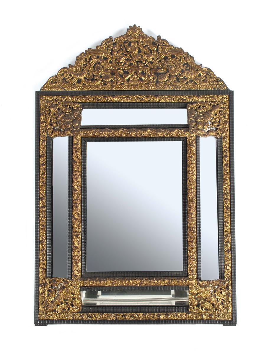 Appraisal: A Dutch ebonised and repouss gilt metal wall mirror