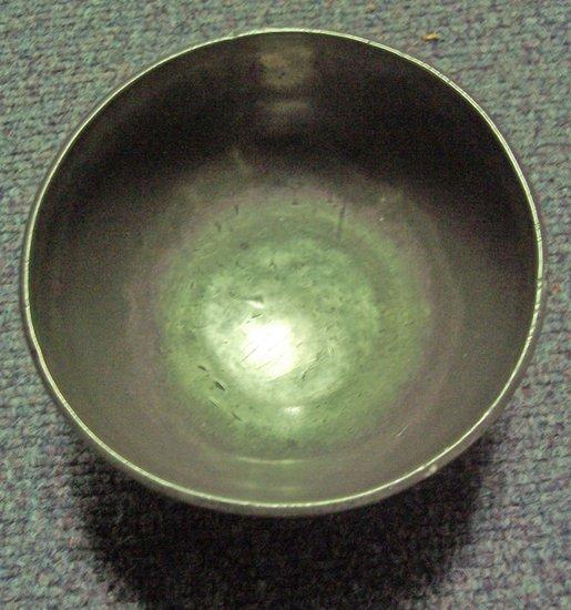 Appraisal: A pewter bowl with rim border on a pedestal base