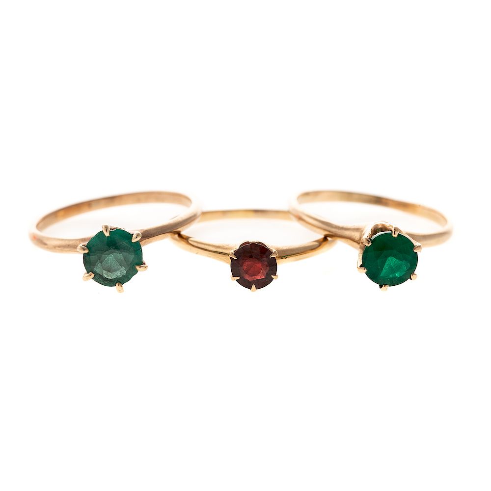 Appraisal: A Trio of Solitaire Gemstone Rings in K Three K