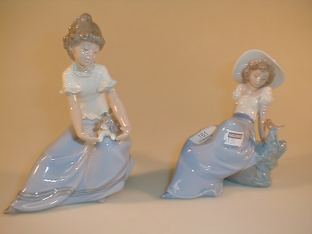 Appraisal: Two Nao figurines one a girl with bird the other