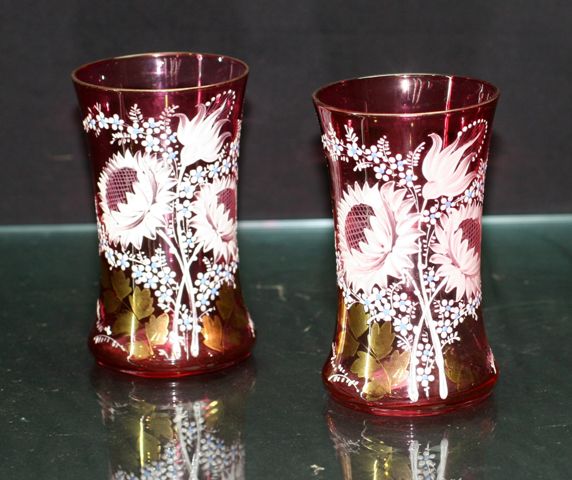 Appraisal: Pair of Victorian cranberry glass wated glasses with enamel floral