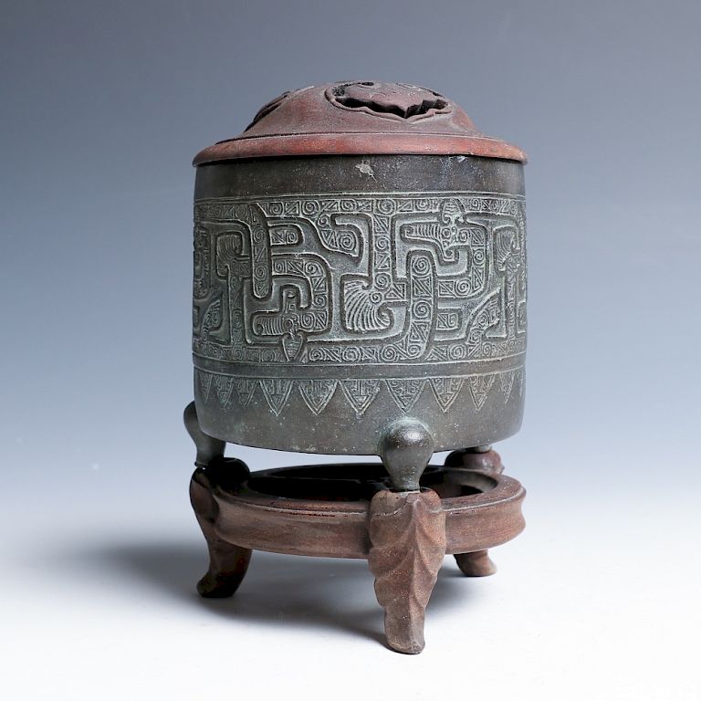 Appraisal: BRONZE INCENSE BRUNER WITH A STAND Of cylindrical form supported