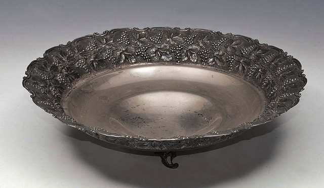 Appraisal: A LARGE GREEK WHITE METAL FRUIT BOWL the borders repouss