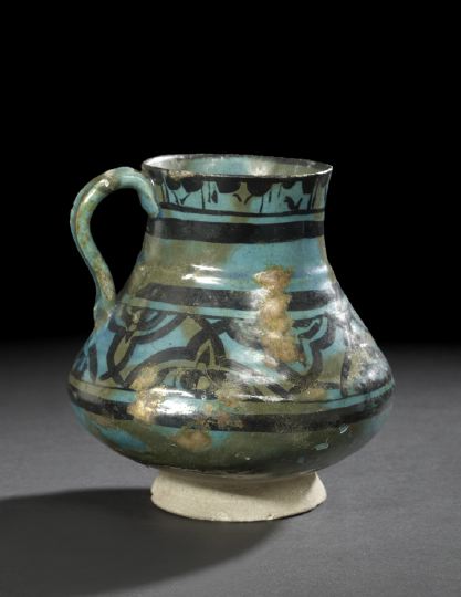 Appraisal: Persian Turquoise- and Black-Glazed Rakka Pottery Jug th- th century