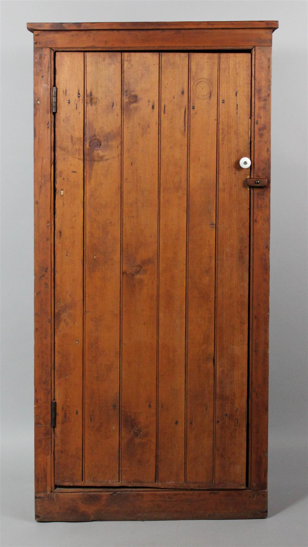 Appraisal: AMERICAN COUNTRY STAINED PINE CUPBOARD the cupboard with a rectangular