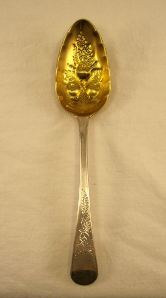 Appraisal: Decorative Sterling Serving Spoon Gold wash bowl with intaglio fruit