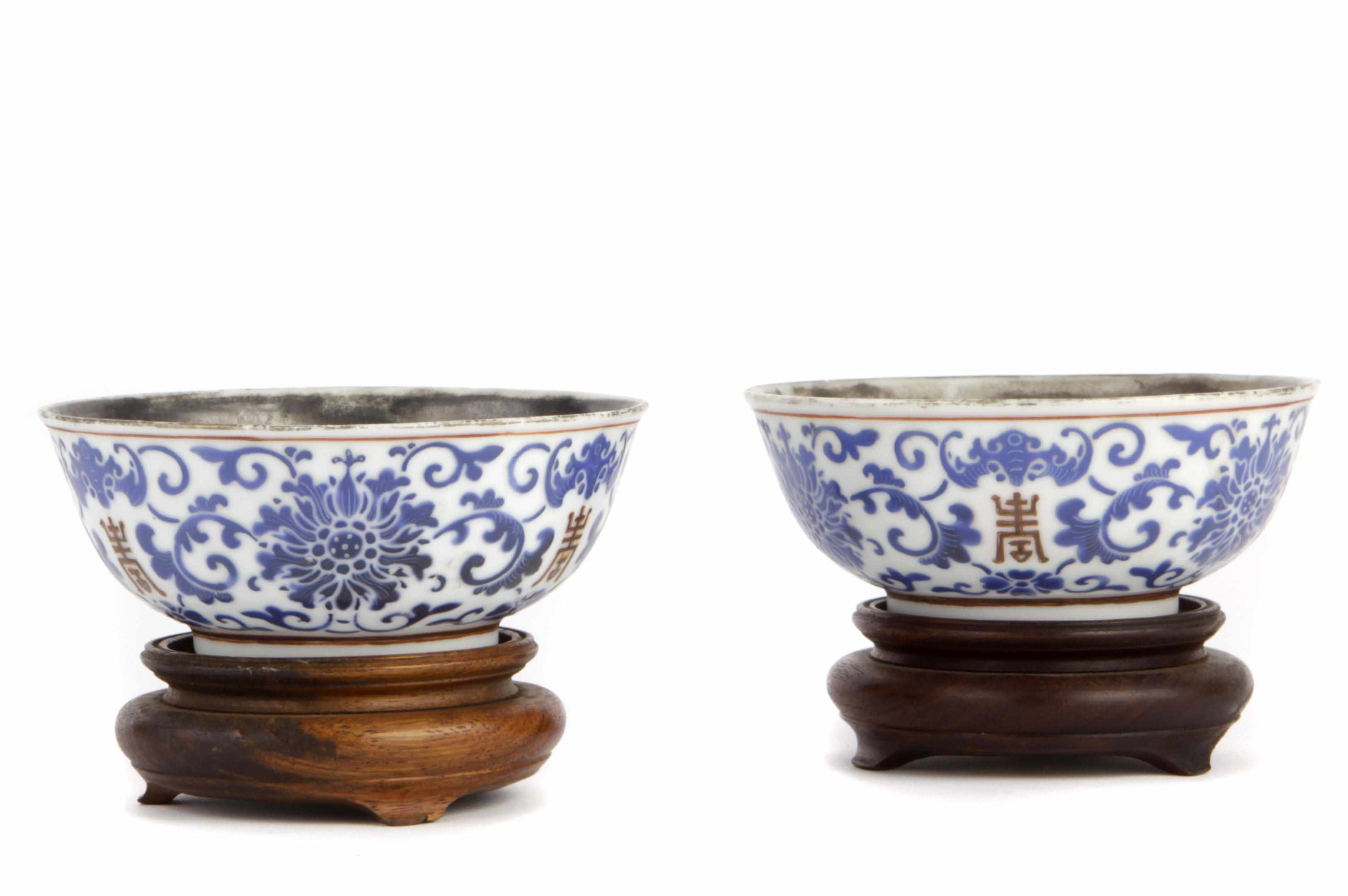 Appraisal: A pair of Chinese blue enameled porcelain bowls with silver