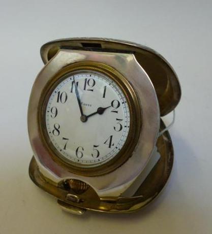 Appraisal: A FOLDING TRAVELLING TIMEPIECE stamped Sterling of rounded oblong form