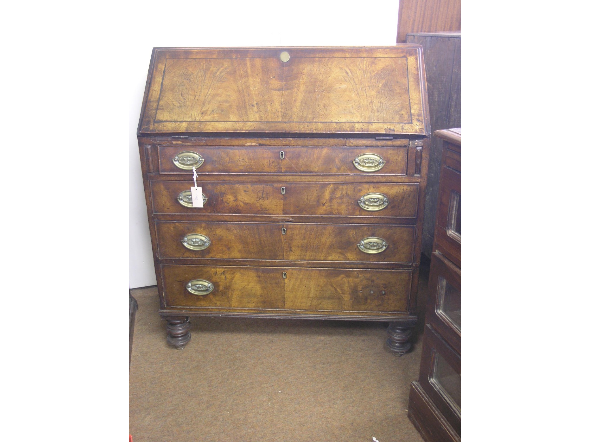 Appraisal: A late George III provincial mahogany bureau fall-front enclosing fittings