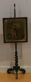 Appraisal: A Victorian pole screen with a petit point panel of