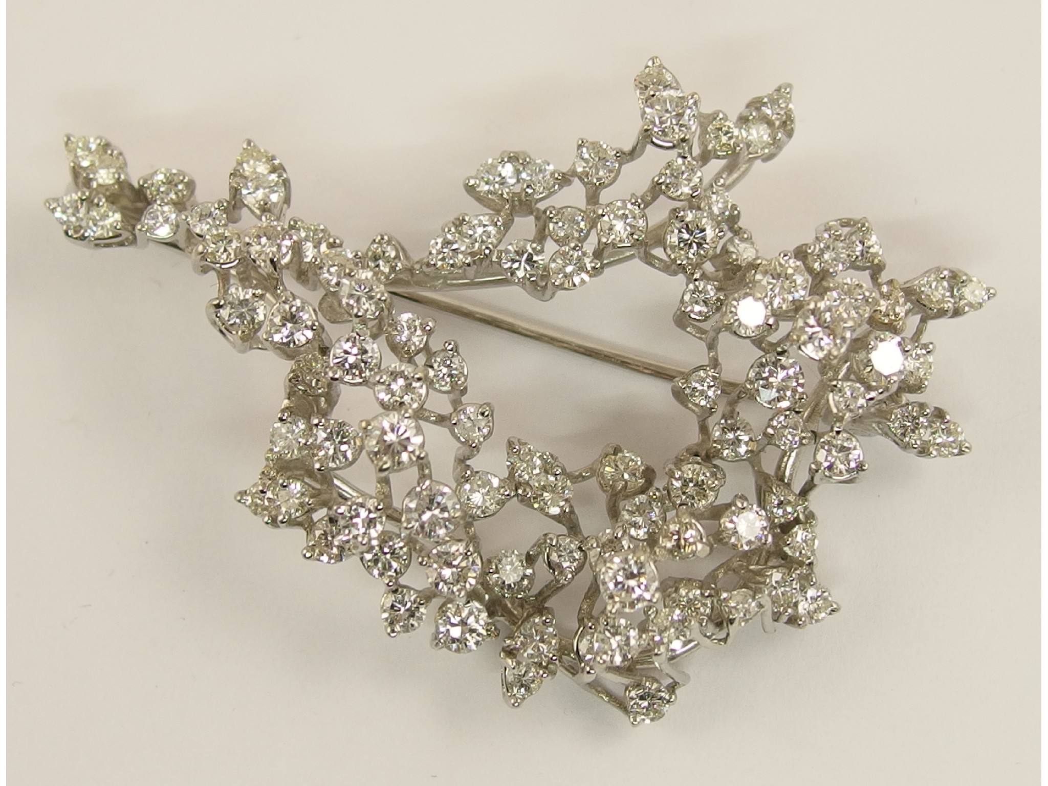 Appraisal: An ct white gold diamond spray broochset with approximately cts