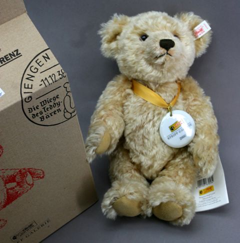 Appraisal: A golden mohair Steiff commemorative bear from complete with button