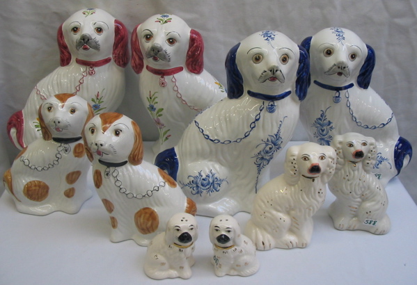 Appraisal: FIVE PAIR OF FIGURAL DOGS painted after the Staffordshire dogs