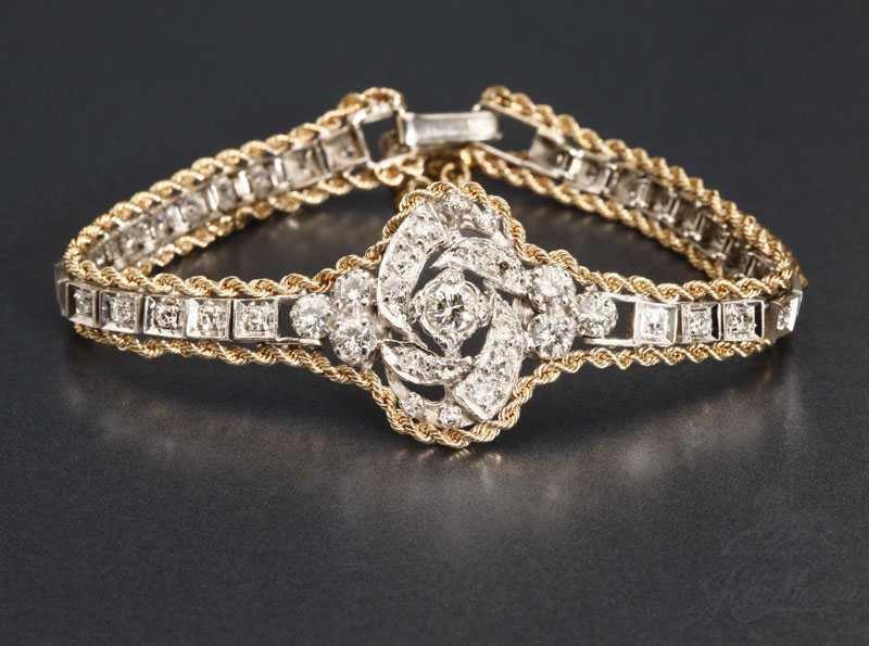 Appraisal: A gold and diamond bracelet A gold and diamond bracelet