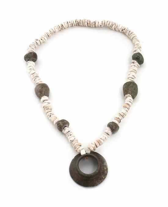 Appraisal: A Pre-Columbian Stone Necklace having disc shaped white stone beads