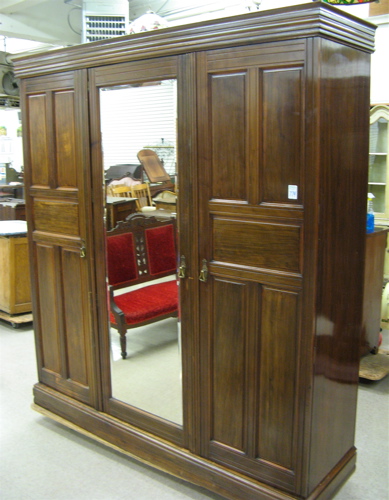 Appraisal: LARGE THREE-DOOR WARDROBE English c The wardrobe has three vertical