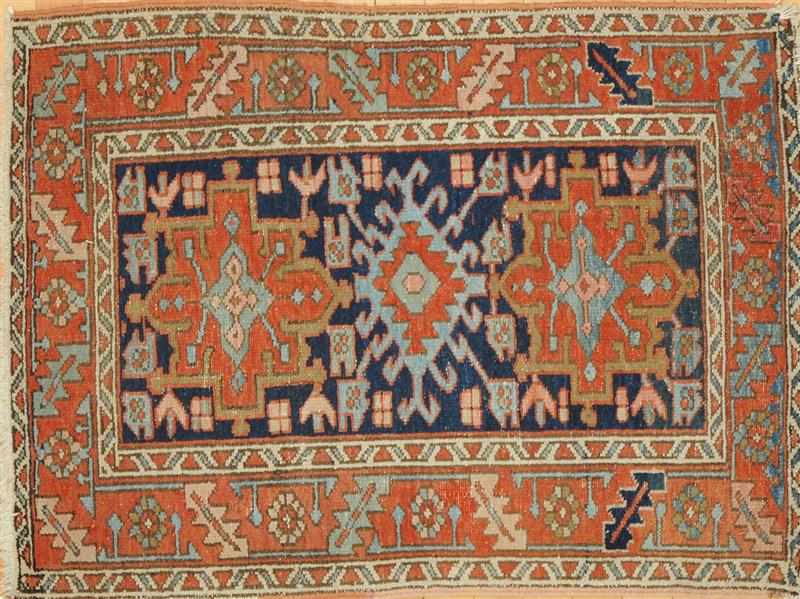 Appraisal: CAUCASIAN BLUE-GROUND RUG Worked with two pale blue orange and