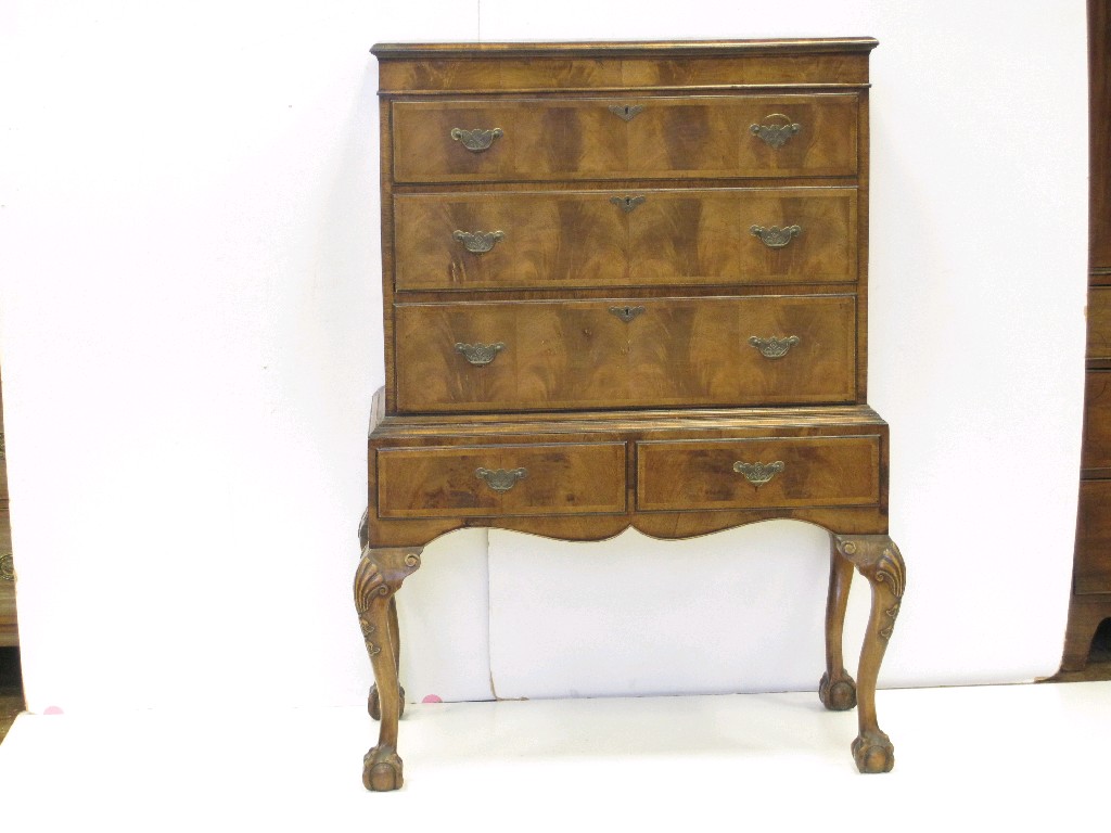 Appraisal: A Queen Anne style walnut Chest on Stand fitted two