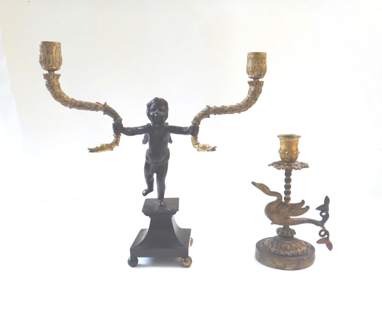 Appraisal: A patinated bronze two branch figural candleabra late th century