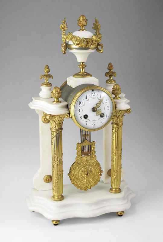 Appraisal: FRENCH MARBLE AND ORMOLU PORTICO MANTLE CLOCK Urn finial with