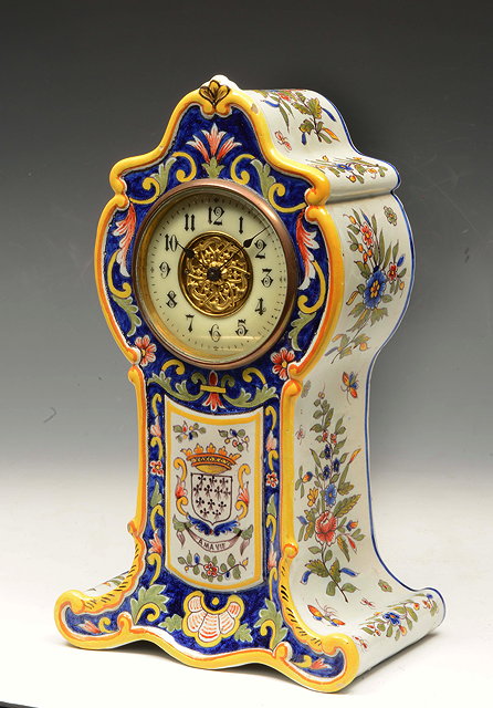 Appraisal: A FRENCH FAIENCE MANTEL TIME PIECE the enamelled chapter ring