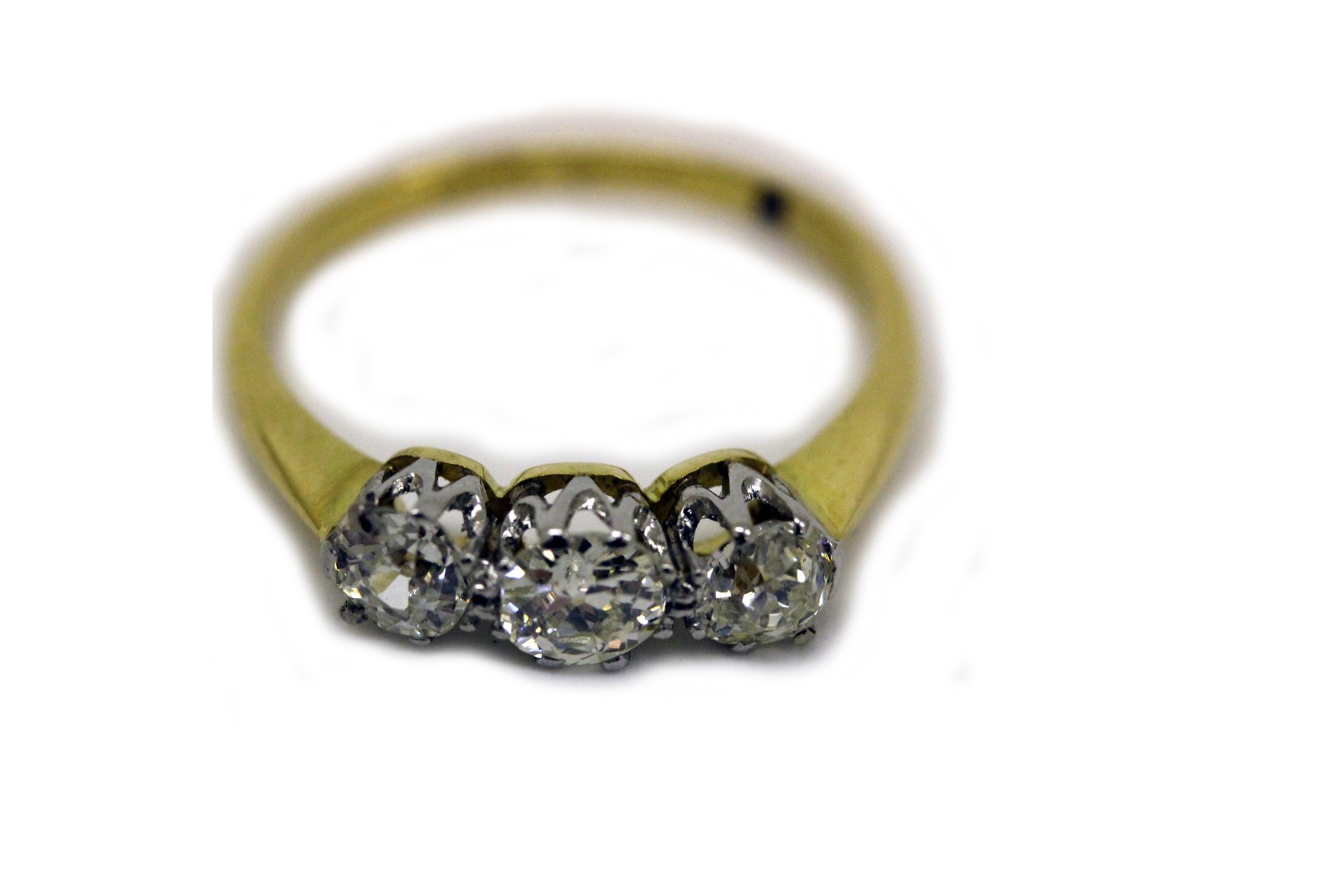 Appraisal: A yellow gold and three-stone diamond ring the old-cut stones