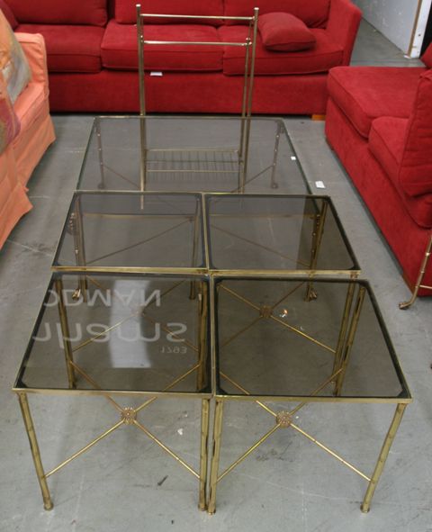 Appraisal: A brass framed glass topped coffee table together with a