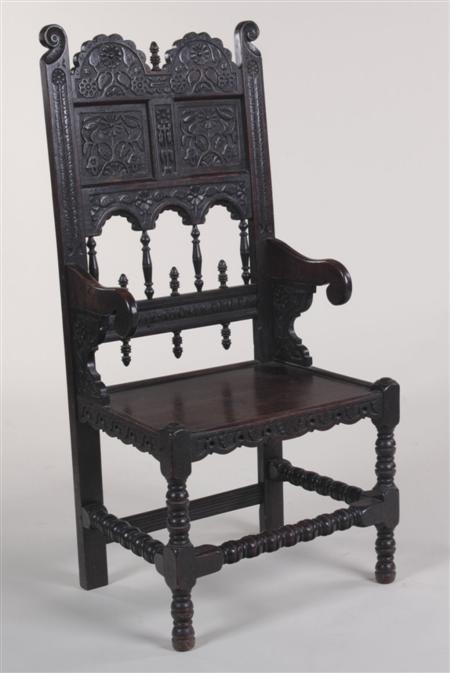 Appraisal: A th century carved oak hall chair the double arched