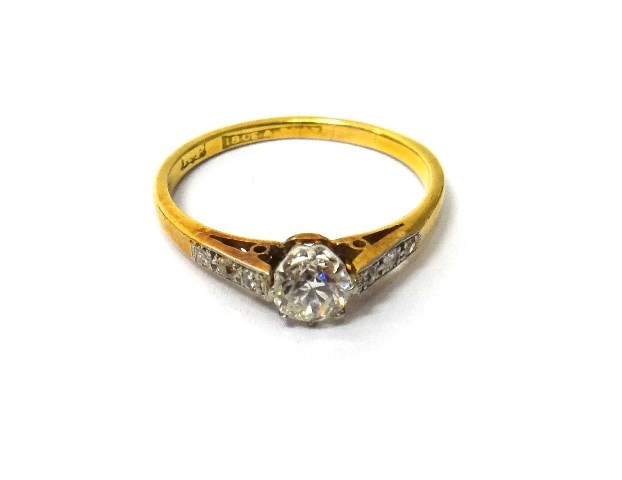 Appraisal: A gold and platinum diamond set ring claw set with