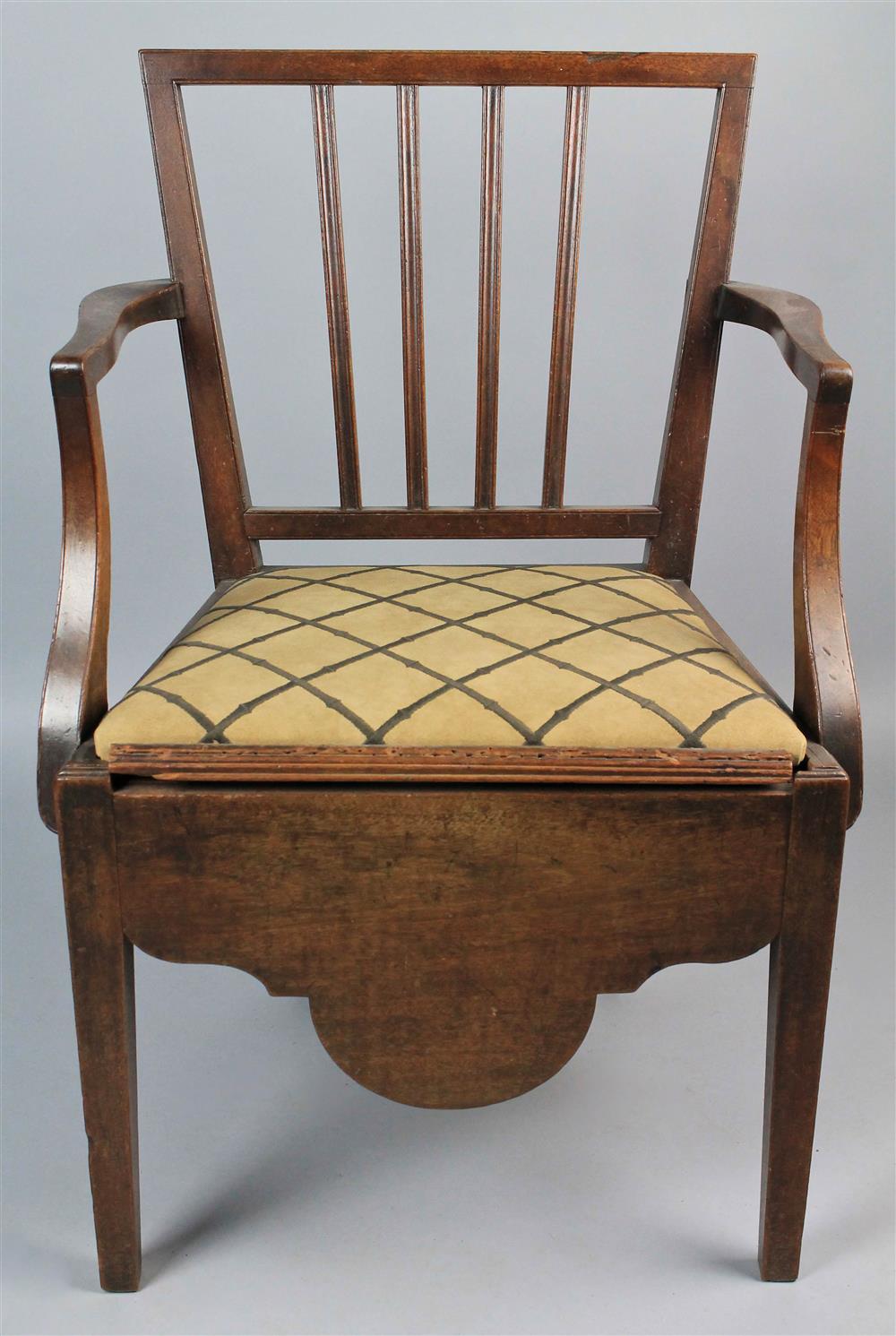 Appraisal: HEPPLEWHITE MAHOGANY CHAMBER CHAIR straight crest rail over a trapezoidal